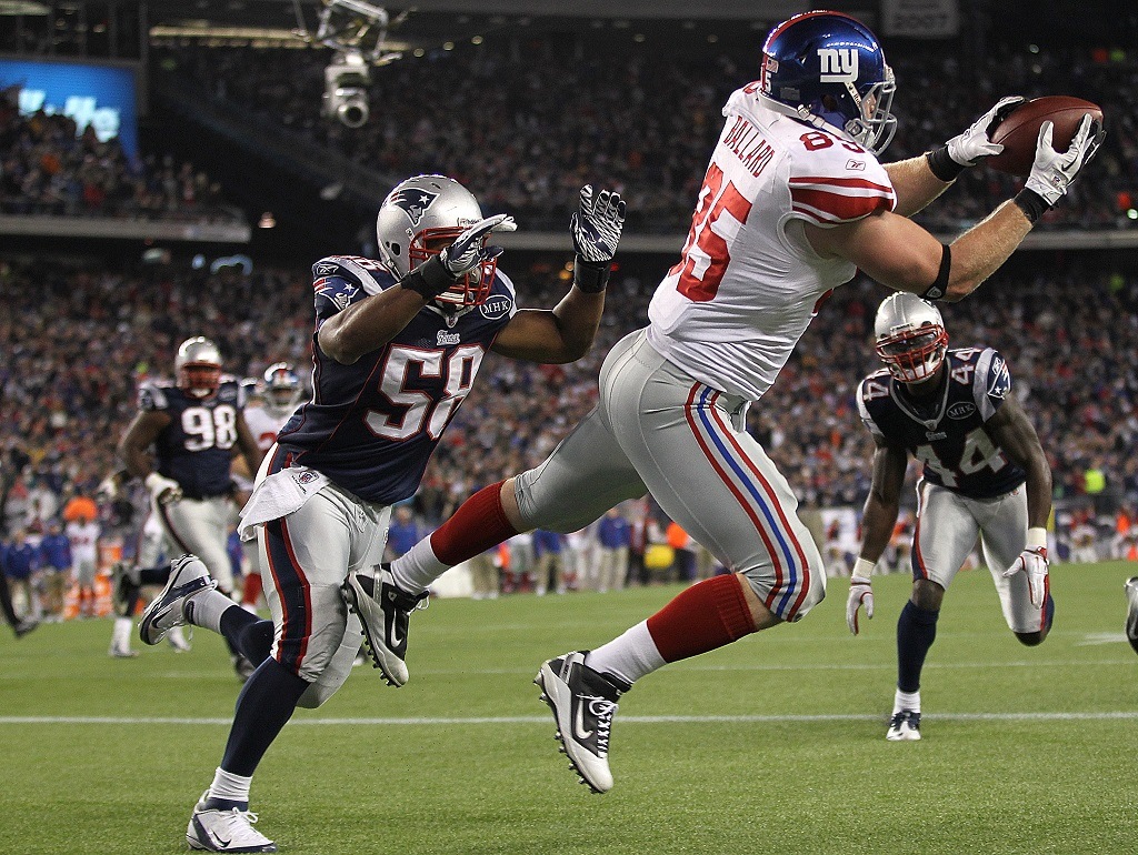 FOXBORO, MA - NOVEMBER 6: Jake Ballard #85 of the New York Giants scores against the defense of Tracy White #58 of the New England Patriots in the second half on November 6, 2011 in Foxboro, Massachusetts. (Photo by Jim Rogash/Getty Images)