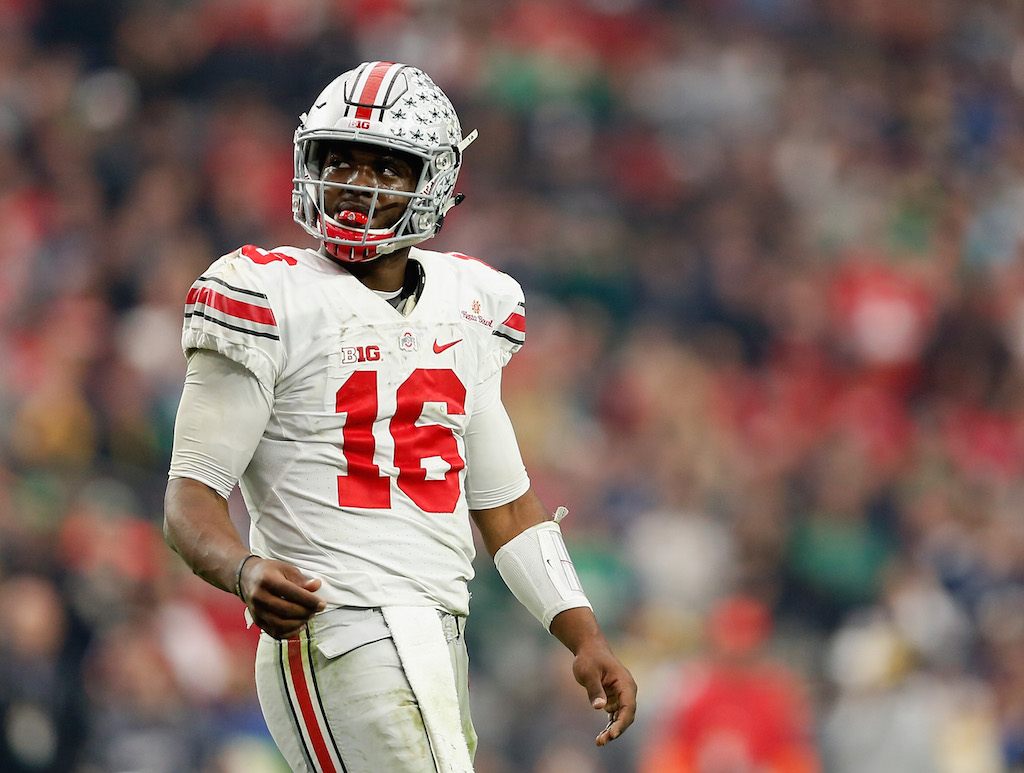 Quarterback J.T. Barrett #16 of the Ohio State Buckeyes looks at the scoreboard between plays.