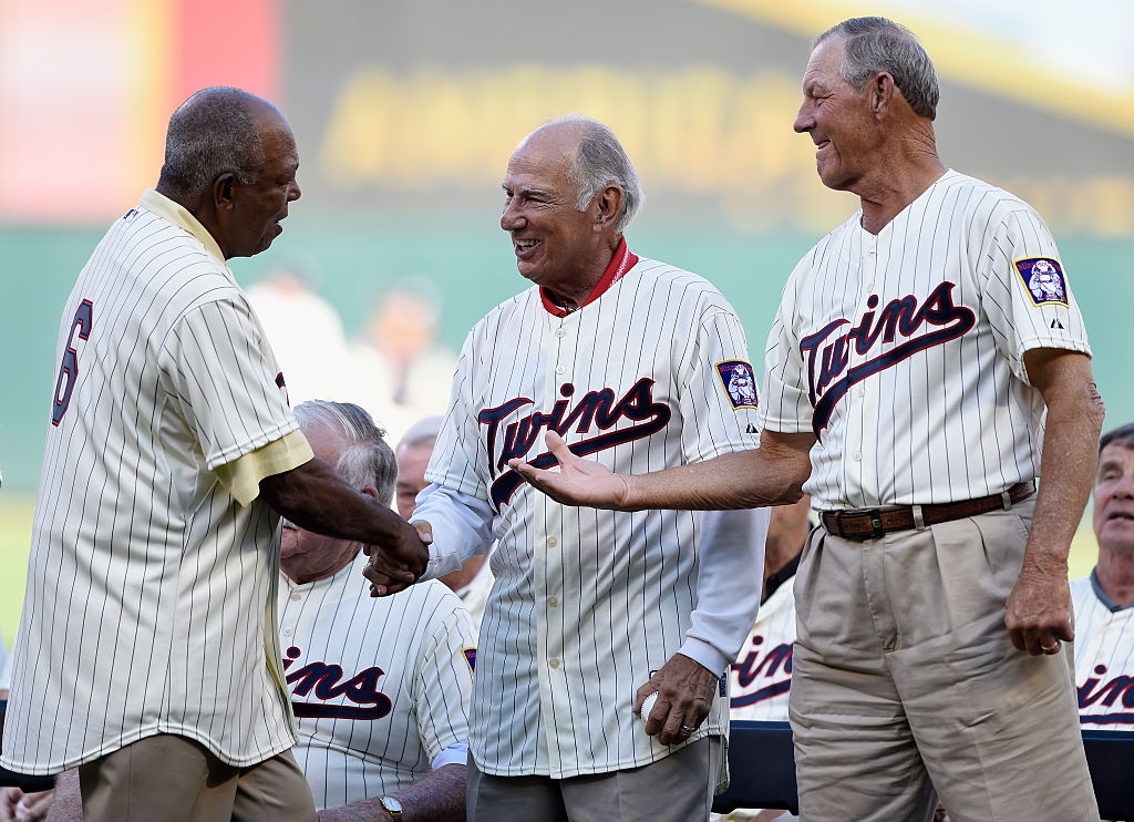 MINNEAPOLIS, MN - AUGUST 1: Tony Oliva, former player with the Minnesota Twins, shakes hands with former teammates Frank Quilici and Jim Kaat during a ceremony honoring the 1965 American League Championship team before the game between the Minnesota Twins and the Seattle Mariners on August 1, 2015 at Target Field in Minneapolis, Minnesota. (Photo by Hannah Foslien/Getty Images)