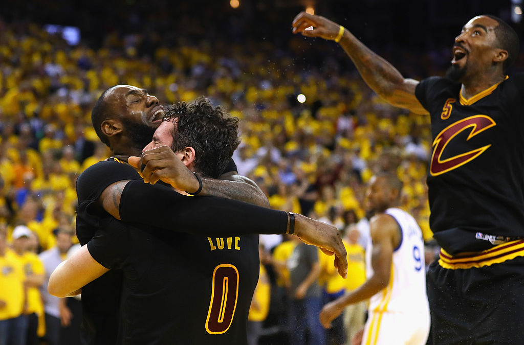 LeBron James, Kevin Love, and J.R. Smith of the Cleveland Cavaliers celebrate after defeating the Golden State Warriors in the 2016 NBA Finals.