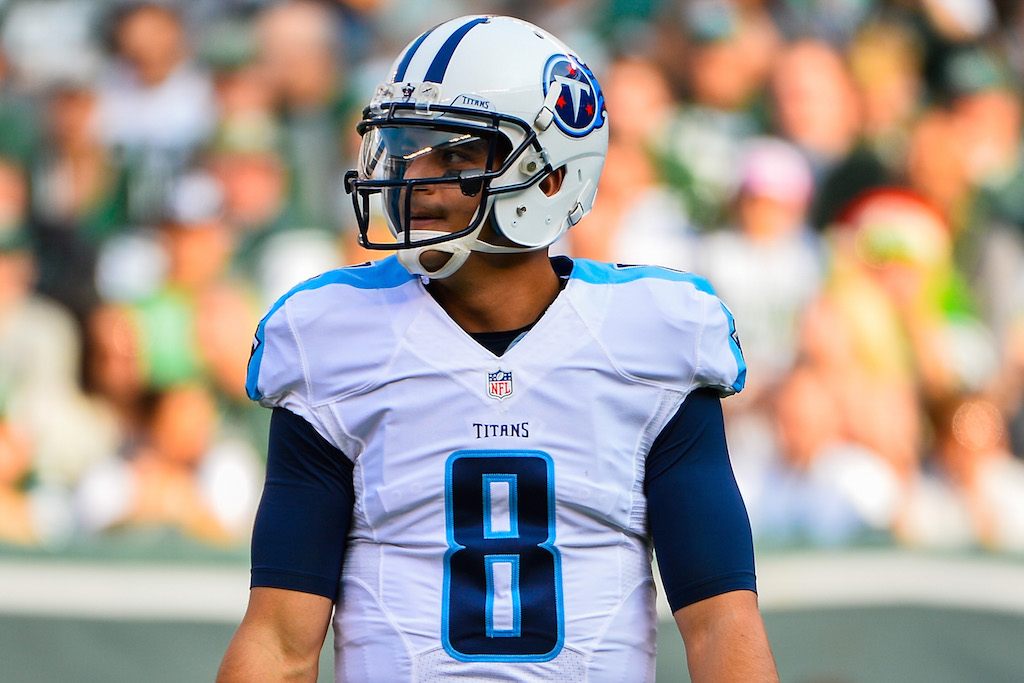 Marcus Mariota walks across the field before a play.