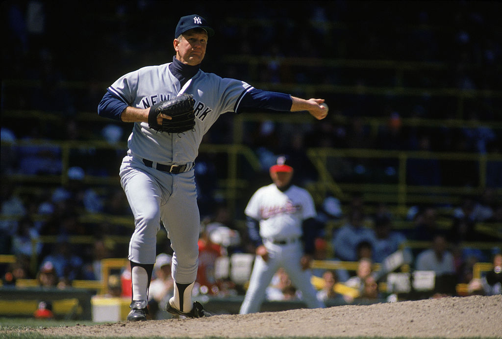 Tommy John #25 of the New York Yankees throws to first base during a 1989 season game