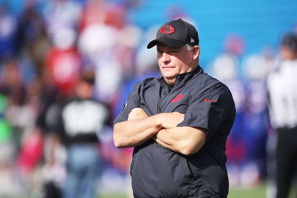 Former 49ers head coach Chip Kelly stands on the sidelines during a game | Tom Szczerbowski/Getty Images