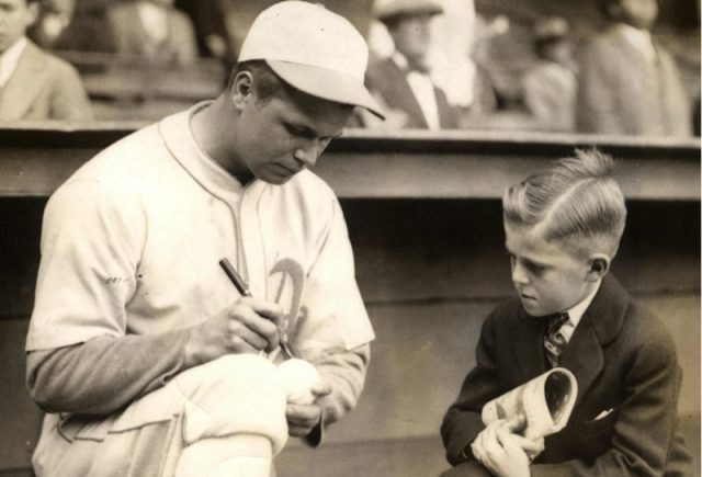 Philadelphia A's Jimmie Foxx with young fan in 1930