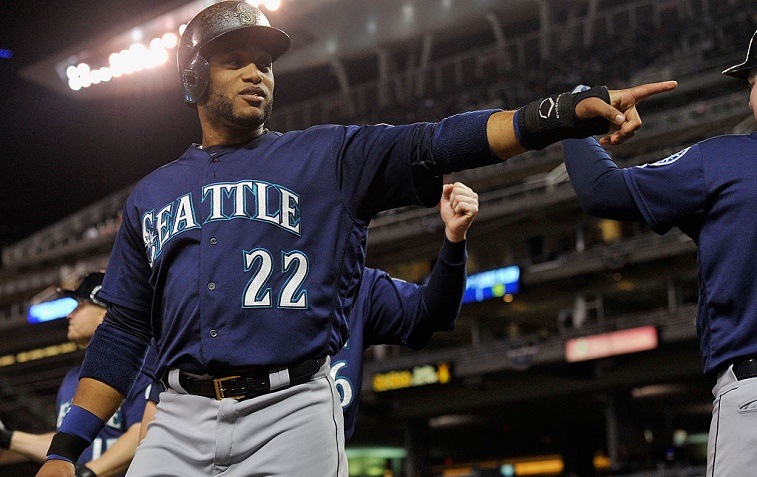 MINNEAPOLIS, MN - SEPTEMBER 23: Robinson Cano #22 of the Seattle Mariners celebrates scoring a run against the Minnesota Twins during the seventh inning of the game on September 23, 2016 at Target Field in Minneapolis, Minnesota. The Mariners defeated the Twins 10-1.