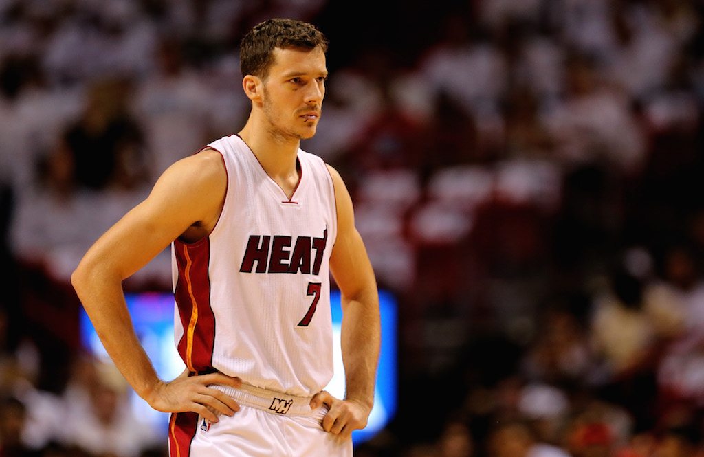 Goran Dragic stands on the court with his hands on his hips.