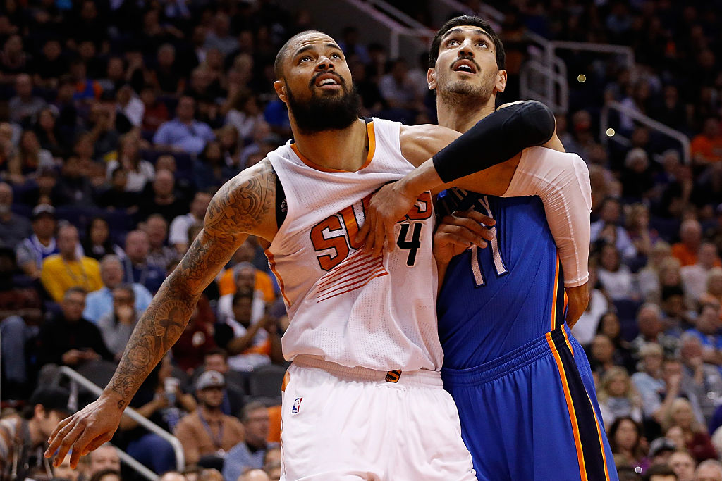 Tyson Chandler #4 of the Phoenix Suns blocks out Enes Kanter #11 of the Oklahoma City Thunder