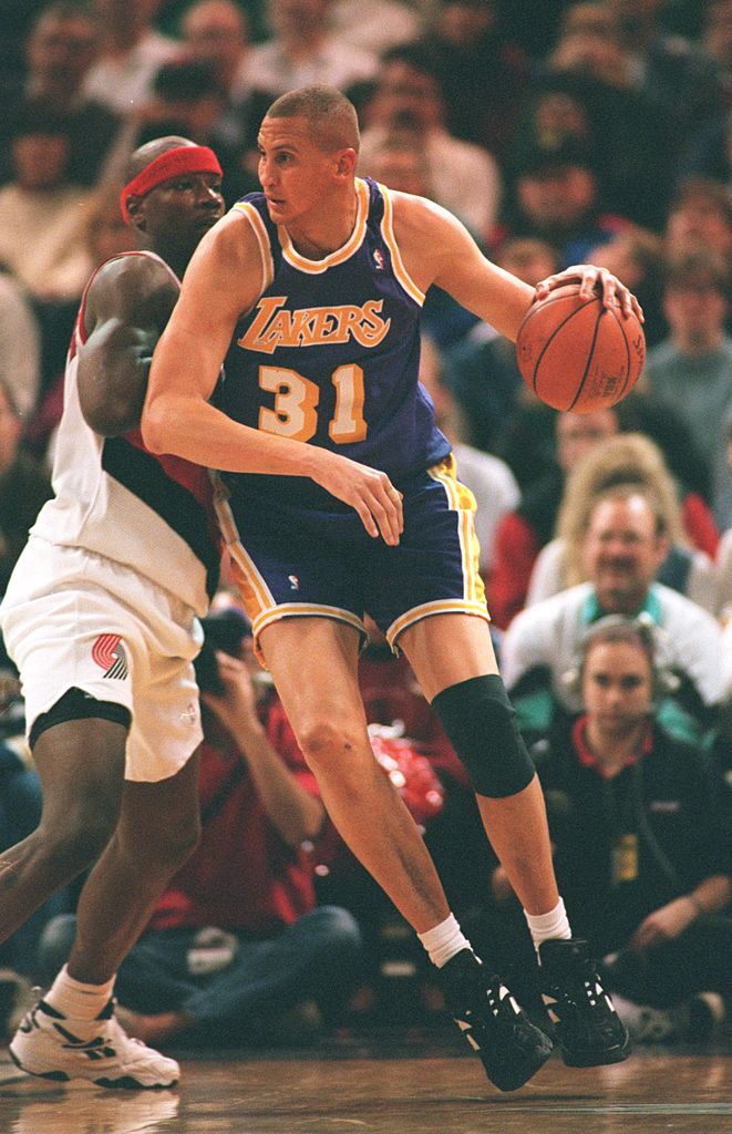 Sam Bowie of the Los Angeles Lakers pushes past a defender.