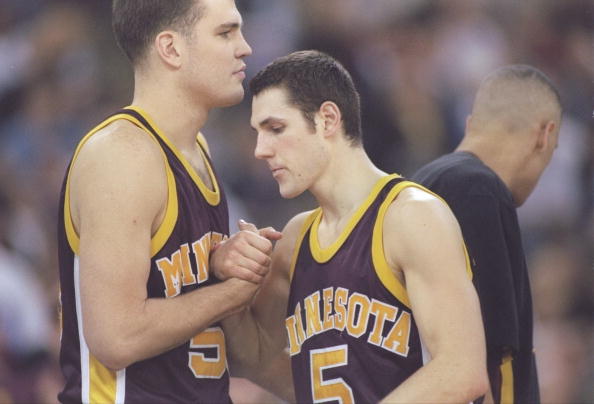 Sam Jacobson of the Minnesota Golden Gophers shakes hands with a teammate