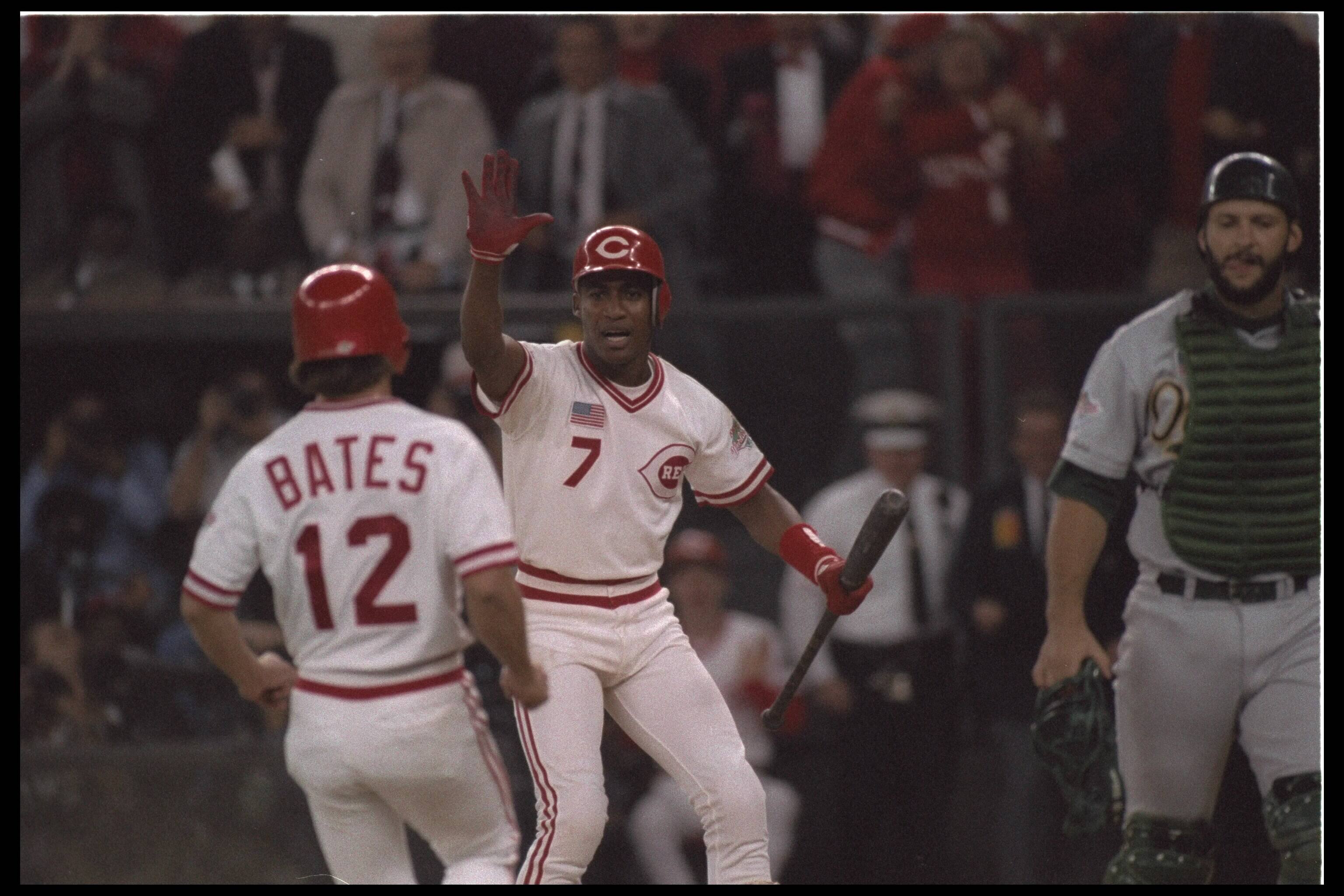 #7 and #12 Bates of the Cincinnati Reds celebrate becoming the World Series winner