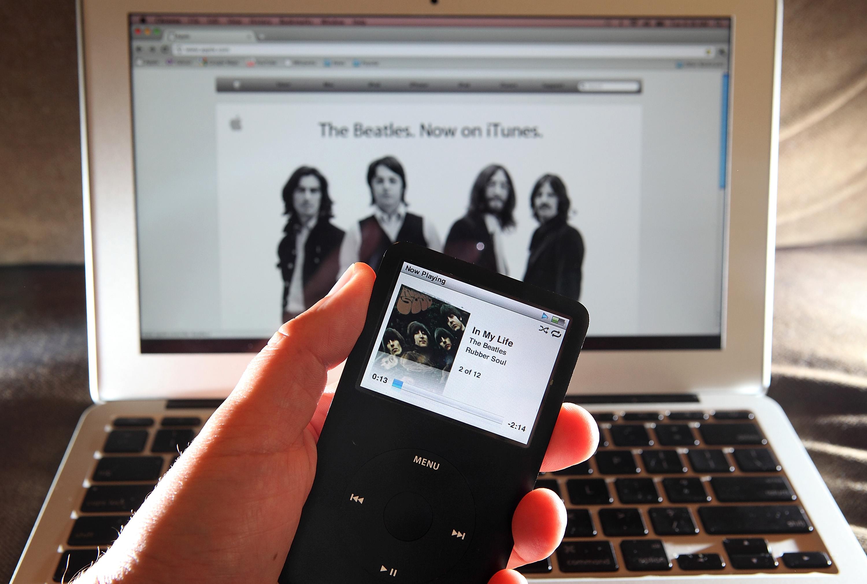 SAN ANSELMO, CA - NOVEMBER 16: A Beatles song plays on an iPod November 16, 2010 in San Anselmo, California. Apple has struck a deal with the record label EMI and the Beatles' company Apple Corps to sell digital downloads of the legendary rock band's music on iTunes. eatles song plays on an iPod