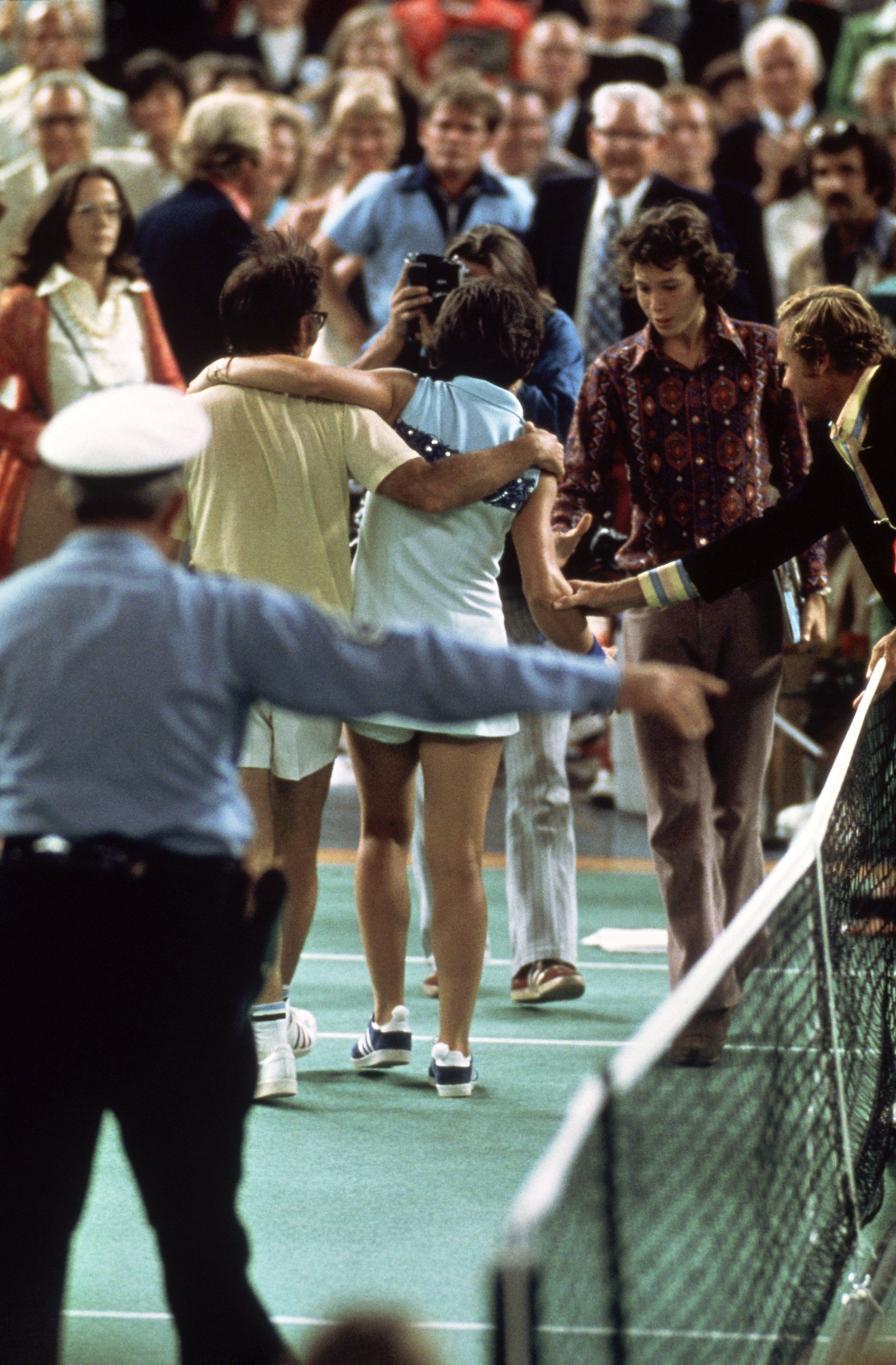 Bobby Riggs of the USA comes off court defeated by Billie Jean-King of the USA