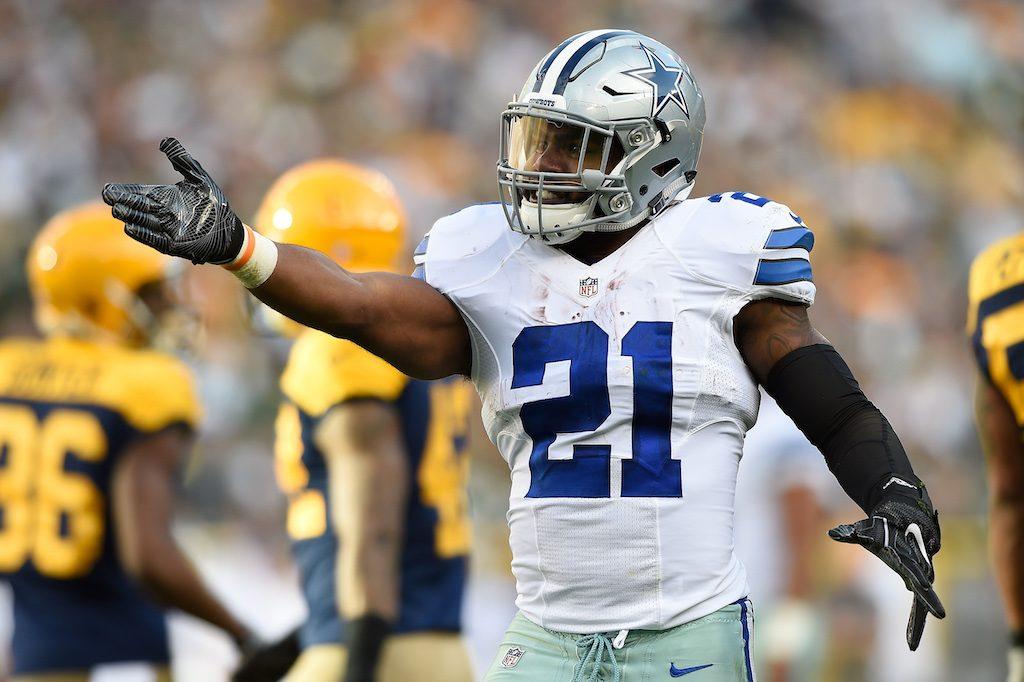 Ezekiel Elliott gestures to the refs about a call.