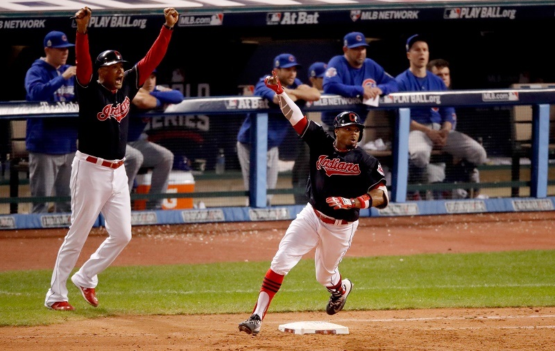 Rajai Davis of the Cleveland Indians celebrates as he runs the bases after hitting a two-run home run during the eighth inning to tie the game 6-6 against the Chicago Cubs in Game Seven of the 2016 World Series at Progressive Field on November 2, 2016 in Cleveland, Ohio.