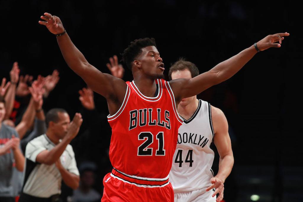 Jimmy Butler raising his arms while playing for the Chicago Bulls.