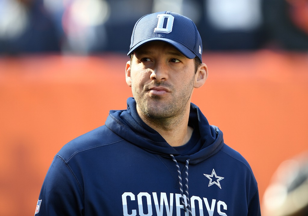 Tony Romo looks on from the sidelines.