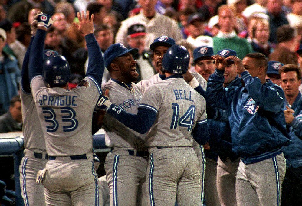 Toronto Blue Jays pinch hitter Ed Sprague (33) is congratulated
