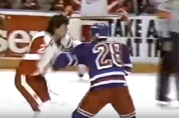 Tie Domi and Bob Probert fight it out on the ice during a 1992 hockey game.