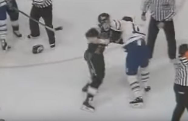 Toronto Maple Leafs center Doug Gilmour fights with Los Angeles Kings defenseman Marty McSorley in a 1993 hockey game