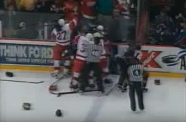 Members of the 1998 Detroit Red Wings and Colorado Avalance fighting on the ice
