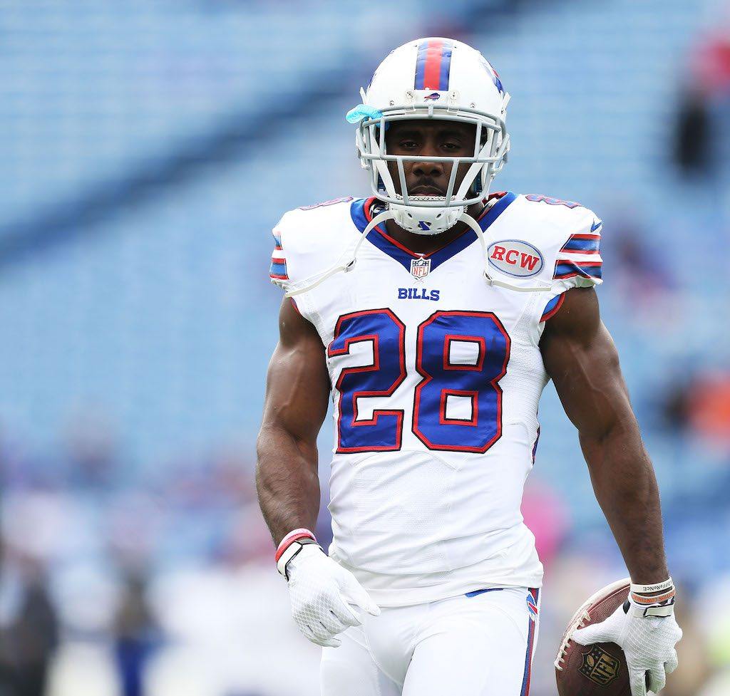 C.J. Spiller grips the football during warmups | Brett Carlsen/Getty Images
