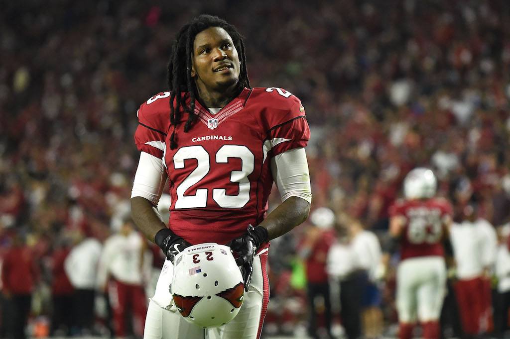 The Arizona Cardinals' Chris Johnson looks up at the crowd after a play | Nils Nilsen/Getty Images