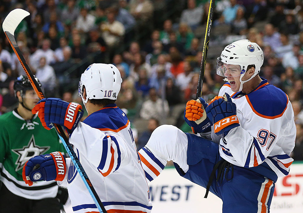 Connor McDavid of the Edmonton Oilers celebrates his first career NHL goal against the Dallas Stars.