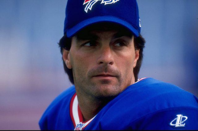 Doug Flutie rests between plays.