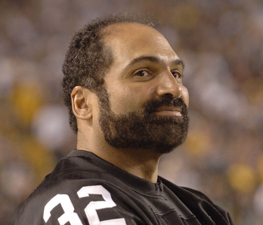 Franco Harris smiles as he's recognized by Steelers fans.