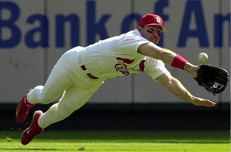 ST. LOUIS, UNITED STATES: St. Louis Cardinals player Jim Edmonds makes a diving attempt on a ball hit by the Atlanta Braves' Rafael Furcal in the first inning of game one of the National League Division Series Playoffs 03 October 2000 at Busch Stadium in St. Louis, Missouri. Edmonds did not make the catch but Furcal was later thrown out attempting to steal second.