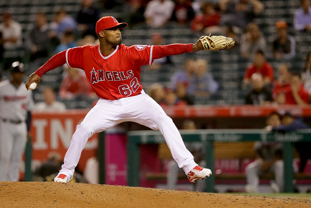 Al Alburquerque of the Los Angeles Angels winds up to throw the ball