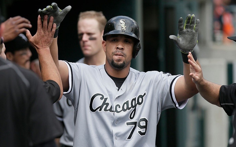 Jose Abreu of the Chicago White Sox is congratulated after hitting a home run against the Detroit Tigers