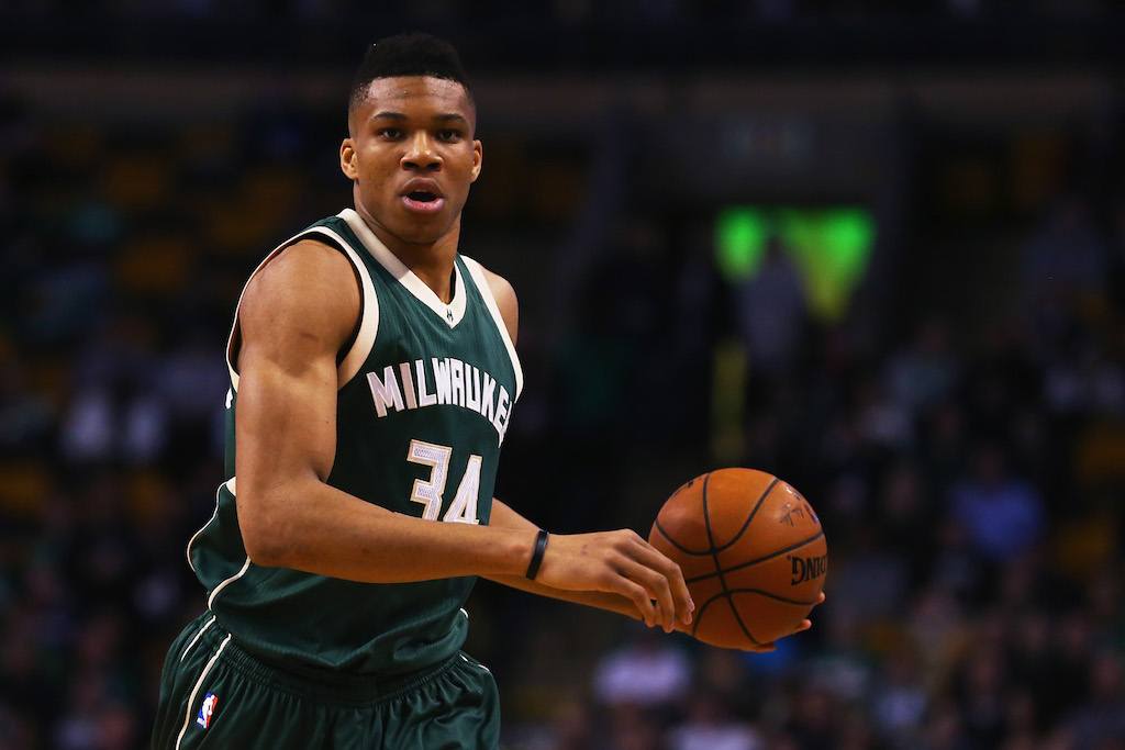 Giannis Antetokounmpo runs with the ball while playing for the Milwaukee Bucks.