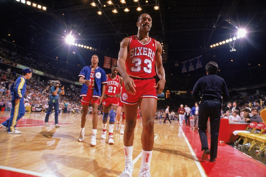 Hersey Hawkins of the Philadelphia 76ers walks off the court
