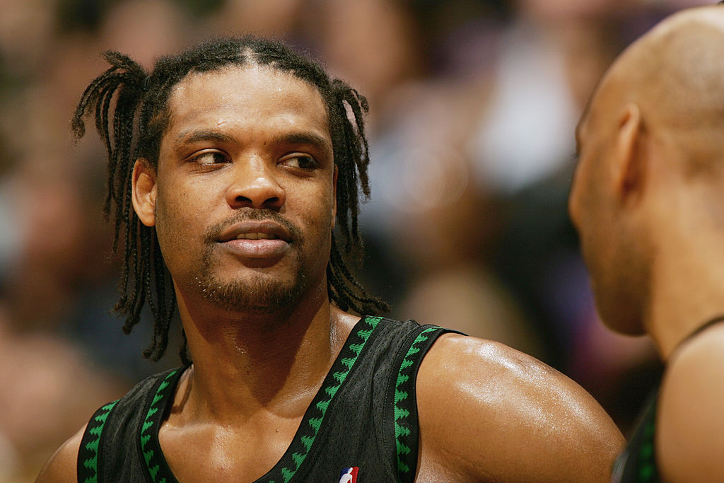 Latrell Sprewell of the Minnesota Timberwolves talks to a teammate during a game.