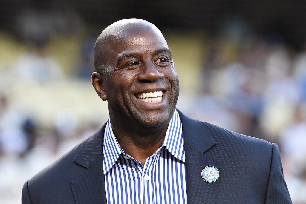 Magic Johnson attends a ceremony honoring Jackie Robinson.