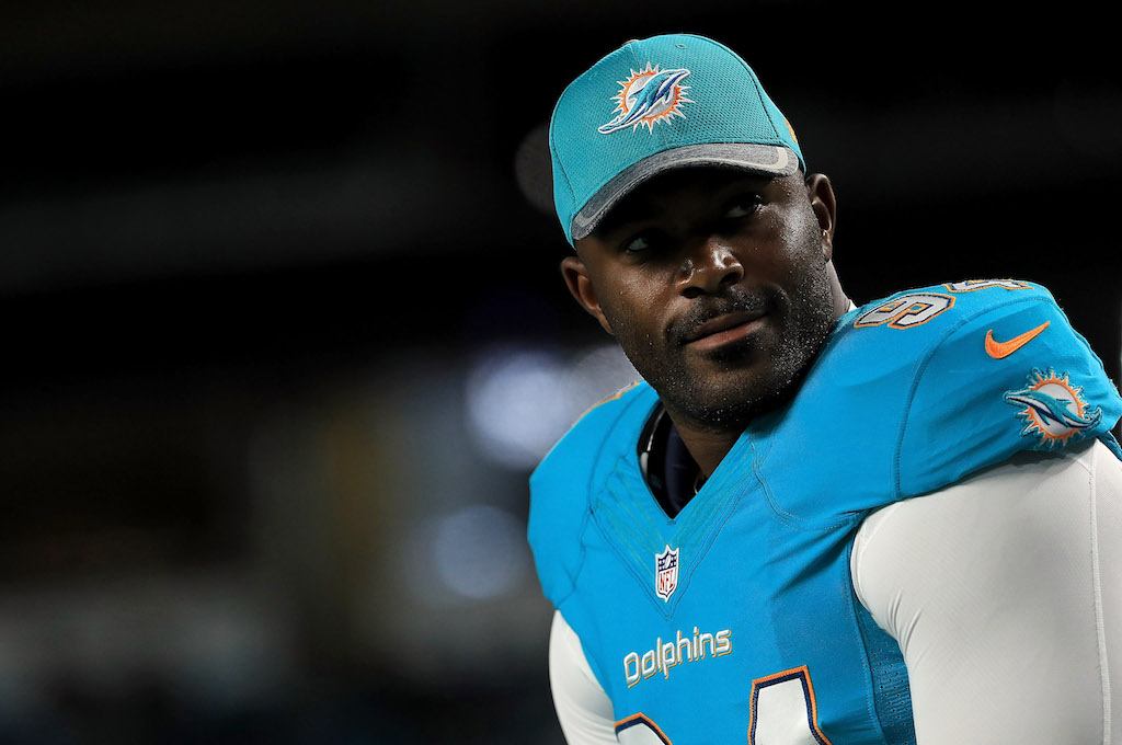 Mario Williams rests on the sidelines during a Miami Dolphins game in 2016.