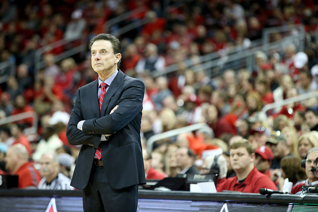 Rick Pitino, head coach of the Louisville Cardinals, looks at the scoreboard.