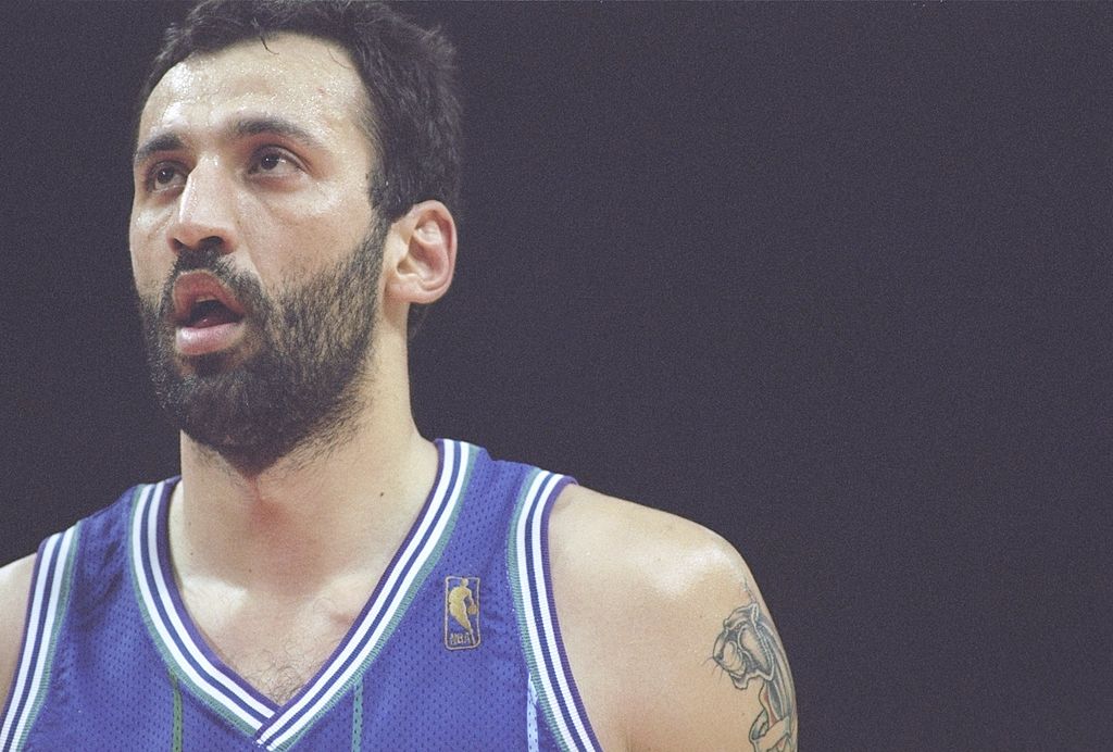 Vlade Divac of the Charlotte Hornets prepares to shoot a free throw.