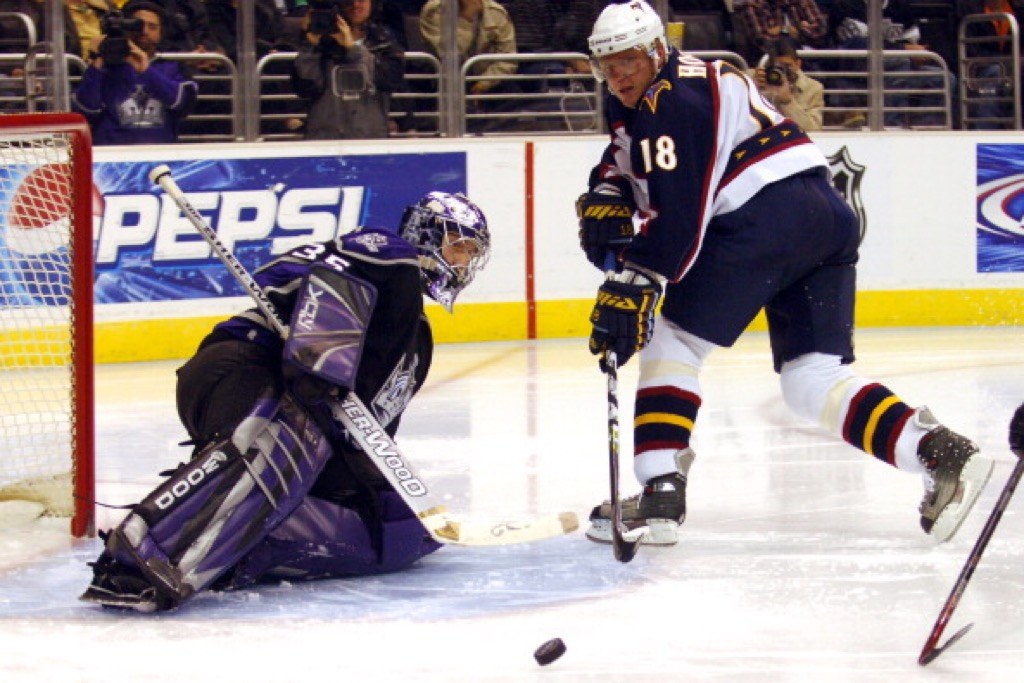 Los Angeles Kings goaltender Jason LaBarbera deflects a shot by Marian Hossa of the Atlanta Thrashers | Kirby Lee/NHLImages
