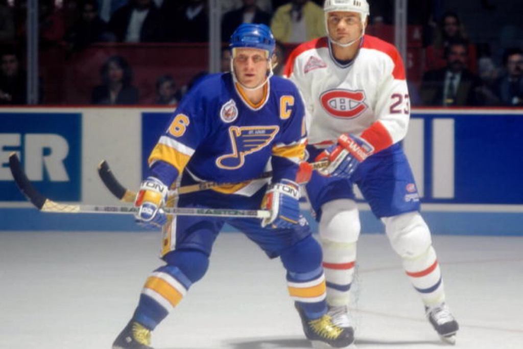 Brett Hull of the St. Louis Blues skates against Brian Bellows of the Montreal Canadiens in the '90s at the Montreal Forum | Denis Brodeur/NHLI via Getty Images