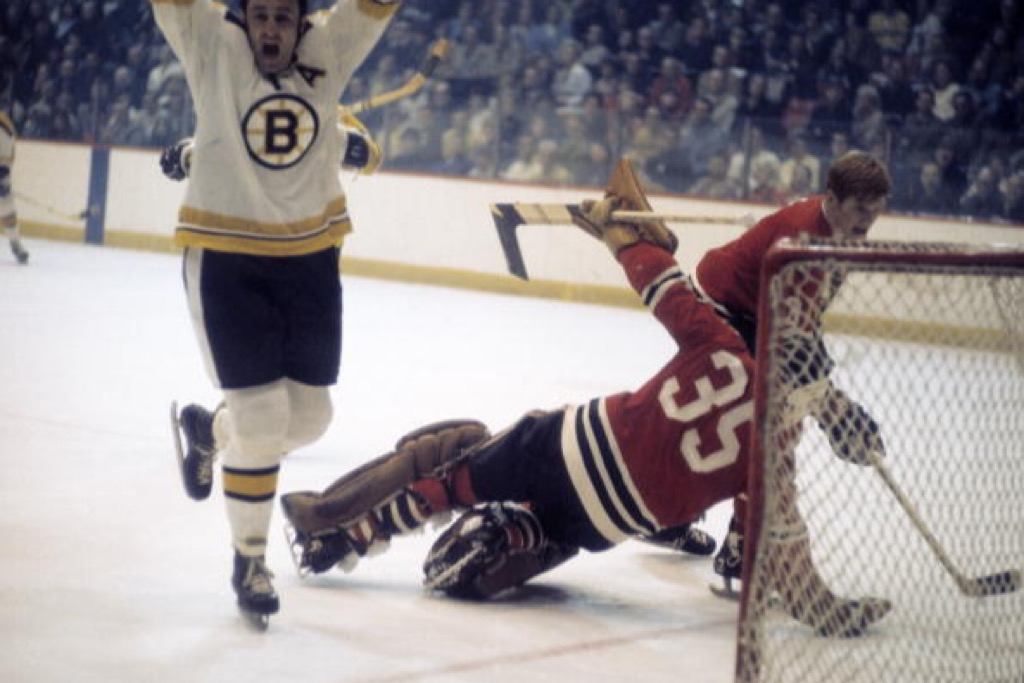 Boston Bruins Phil Esposito celebrates after scoring a goal against the Chicago Blackhawks goalie Tony Esposito | Heinz Kluetmeier/Sports Illustrated/Getty Images