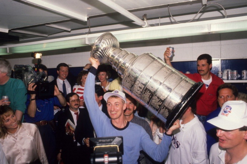 The Edmonton Oilers' Wayne Gretzky celebrates with the Stanley Cup trophy | David E. Klutho/Sports Illustrated/Getty Images
