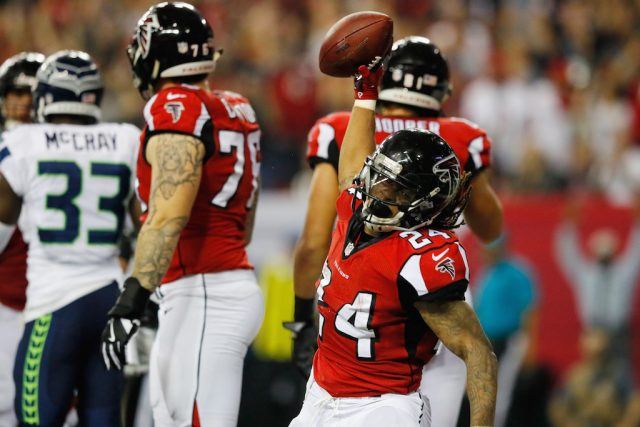 Devonta Freeman slams the football to the ground after a touchdown.
