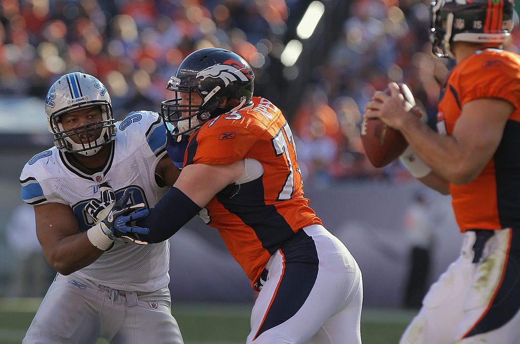 Defensive tackle Ndamukong Suh of the Detroit Lions battles against the block of offensive guard Chris Kuper of the Denver Broncos.