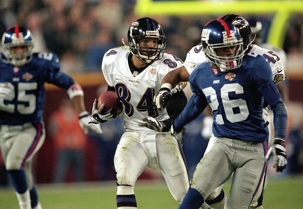 Jermaine Lewis of the Baltimore Ravens runs with the ball for a run back touchdown during Super Bowl XXXV.
