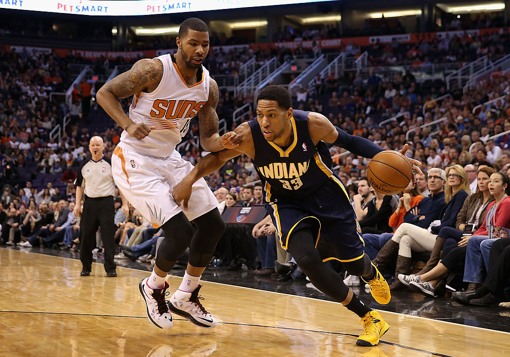 Danny Granger of the Indiana Pacers moves the ball past Marcus Morris of the Phoenix Suns.