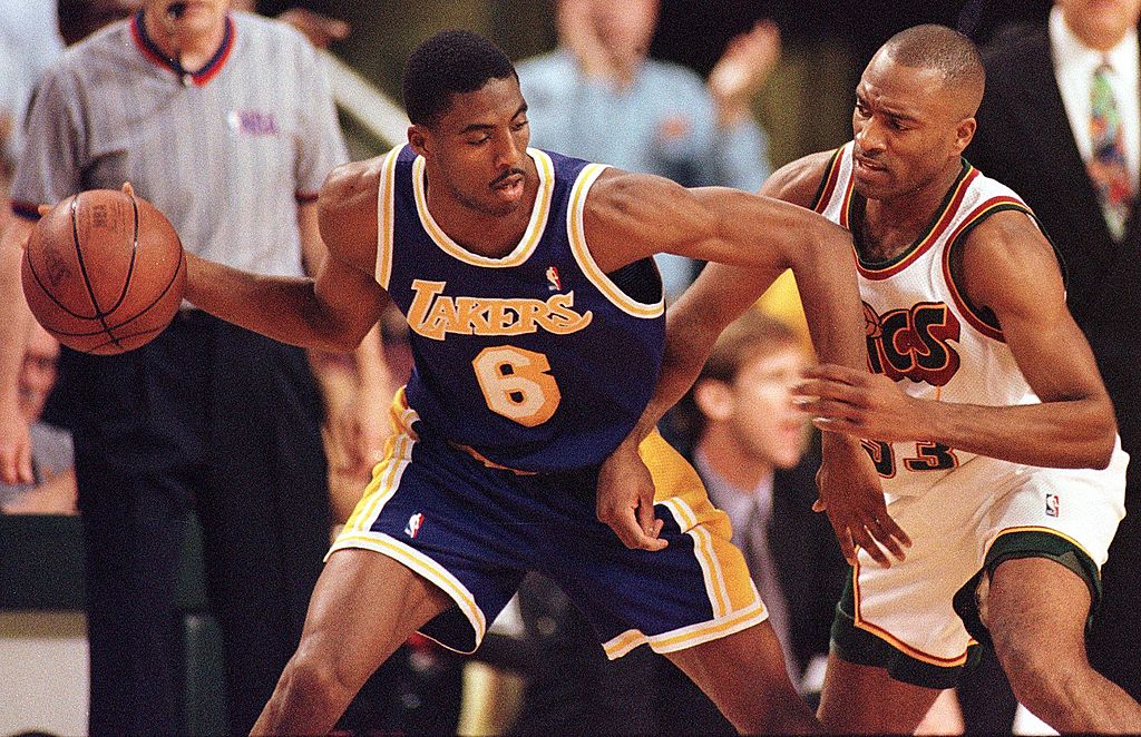Los Angeles Lakers' Eddie Jones drives against Seattle SuperSonics' Hersey Hawkins.