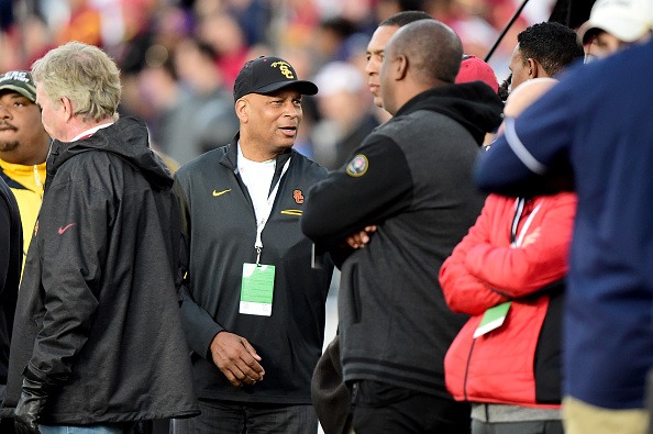 Ronnie Lott talks with Marcus Allen and Rodney Peete as the USC Trojans take on the Penn State Nittany Lions.