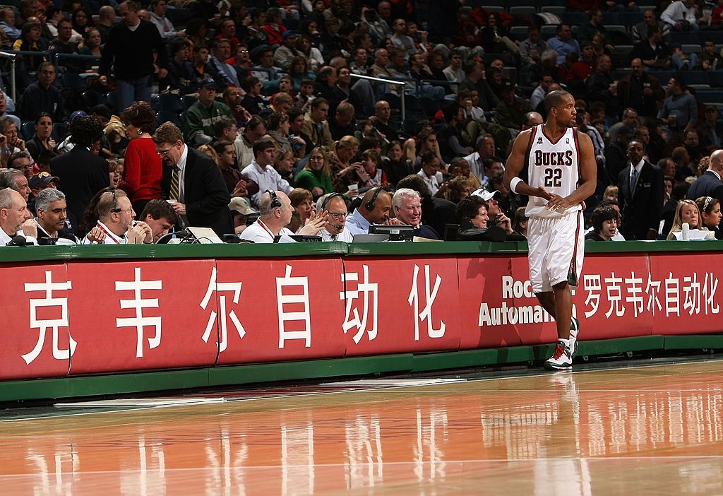 Michael Redd of the Milwaukee Bucks walks in front of the scorers' table.
